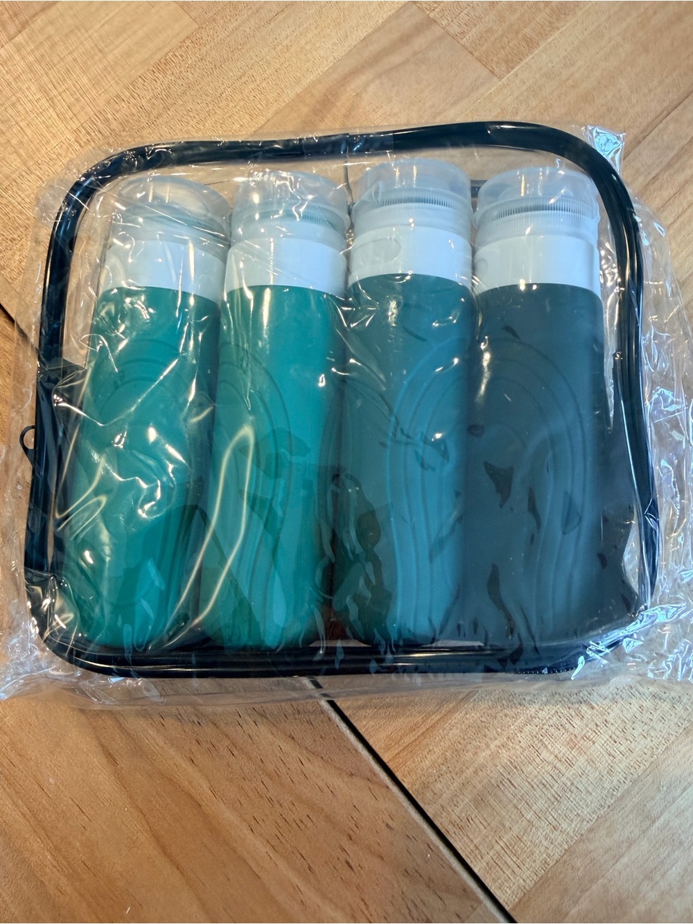 Travel Silicone Bottles Set in Teal and Dark Green - Clear Carry Case
